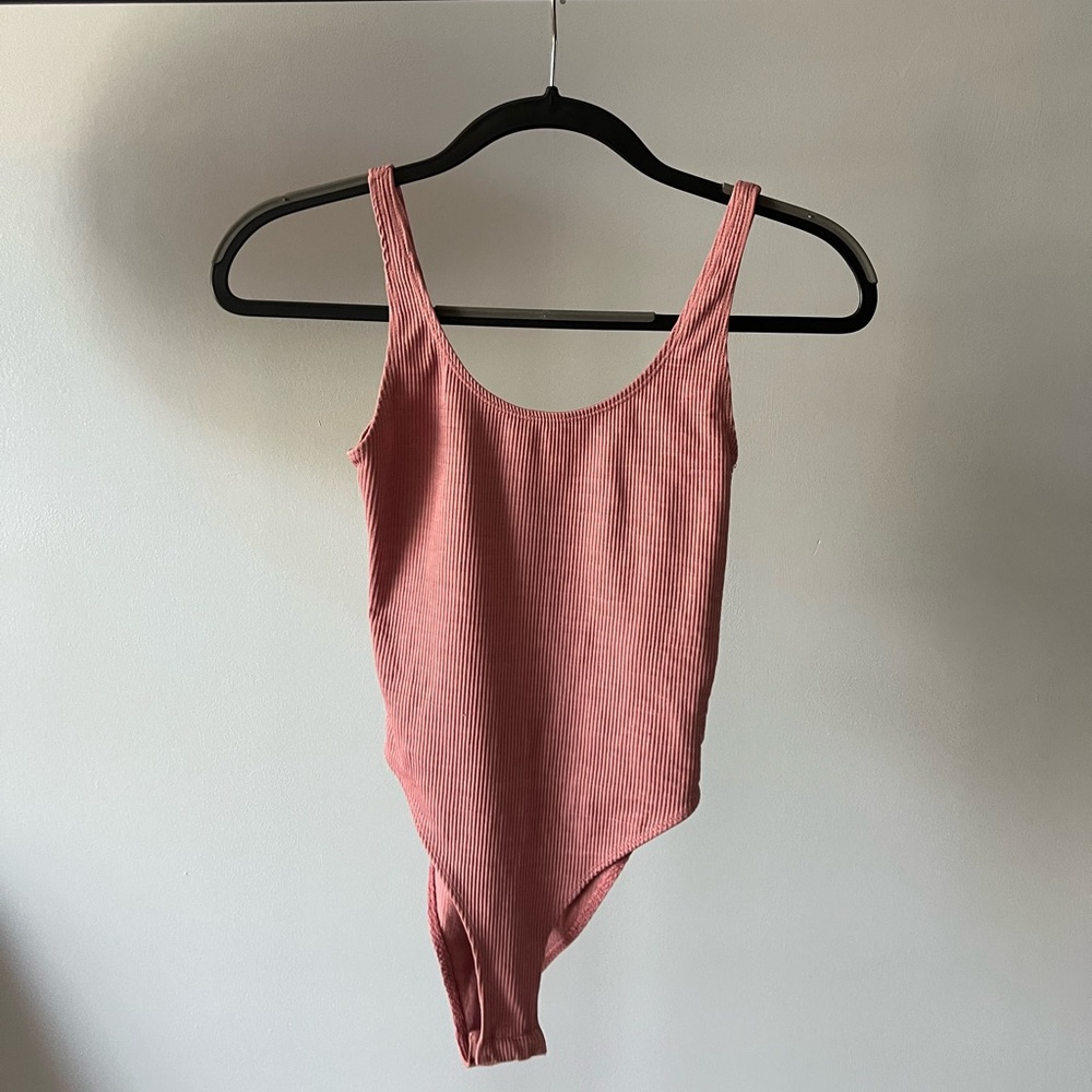 Pink ribbed body suit
